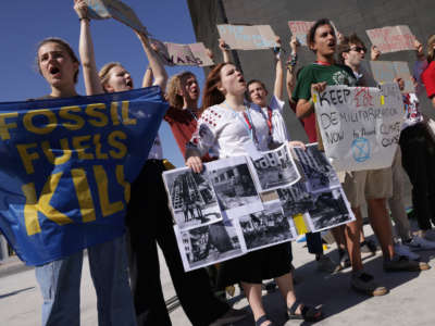 Protesters demanding an end to fossil fuel dependence that enables wars, including Russia's current war in Ukraine, demonstrate during the UNFCCC COP27 climate conference on November 12, 2022, in Sharm el-Sheikh, Egypt.