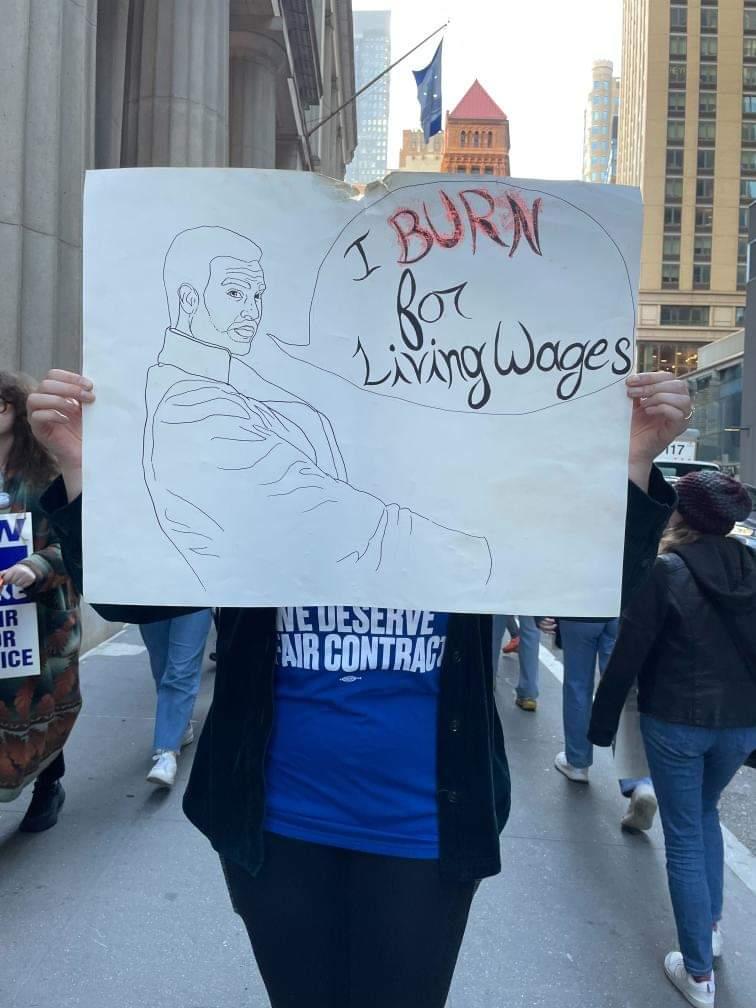 A sign seen on the picket line of striking HarperCollins employees on November 10, 2022.