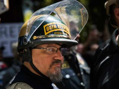 An Oath Keeper, brought on to provide security, stands guard during a pro-Donald Trump rally at Martin Luther King Jr. Civic Center Park in Berkeley, California on April 27, 2017.