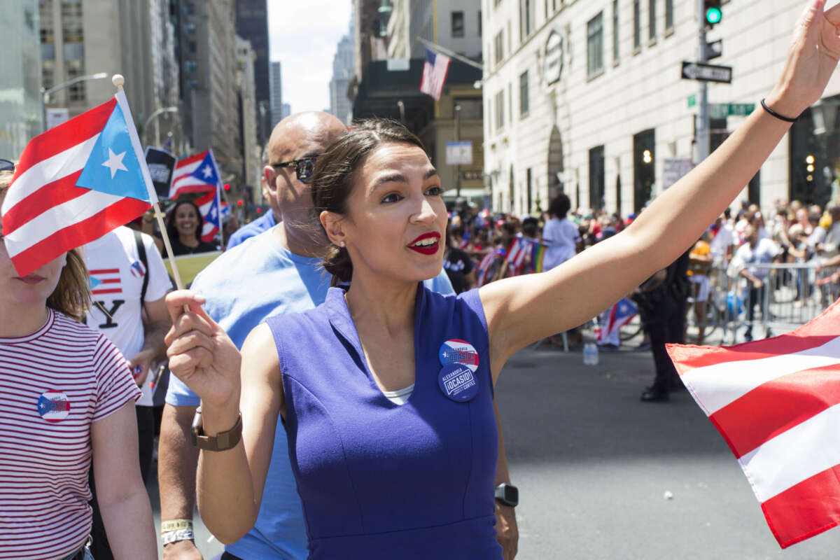 Congresswoman Alexandria Ocasio-Cortez marches during the 62nd annual Puerto Rican Day Parade on June 9, 2019 in New York, New York.