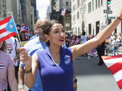 Congresswoman Alexandria Ocasio-Cortez marches during the 62nd annual Puerto Rican Day Parade on June 9, 2019 in New York, New York.