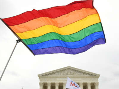 Demonstrators in favor of LGBT rights rally outside the Supreme Court in Washington, D.C., on October 8, 2019.