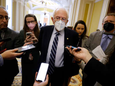 Sen. Bernie Sanders talks to reporters at the U.S. Capitol on December 1, 2022, in Washington, D.C.