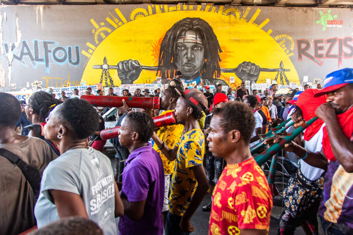 Demonstrators from different cities, holding banners and placards, protest to demand the removal of Prime Minister Ariel Henry in Port-au-Prince, Haiti, on September 7, 2022.