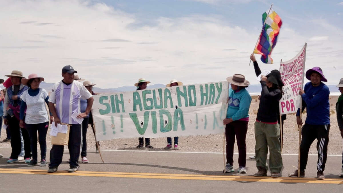 Members of the Indigenous communities of Salinas Grandes block the route between Argentina and Chile to protest lithium extraction in 2018.
