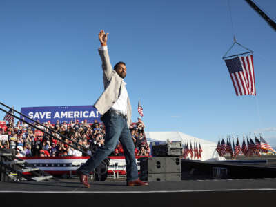 Former Chief of Staff to the Department of Defense Kash Patel greets the crowd during a campaign rally at Minden-Tahoe Airport on October 8, 2022, in Minden, Nevada.