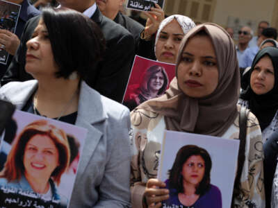 Palestinians take part in a demonstration following the death of veteran Al-Jazeera journalist Shireen Abu Akleh in Gaza City on May 15, 2022.