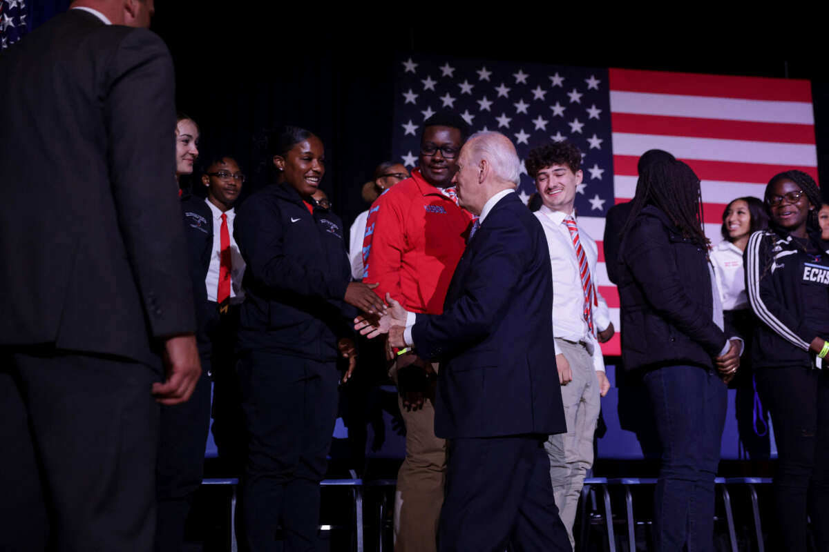 President Joe Biden greets students after speaking about student debt relief at Delaware State University in Dover, Delaware, on October 21, 2022.