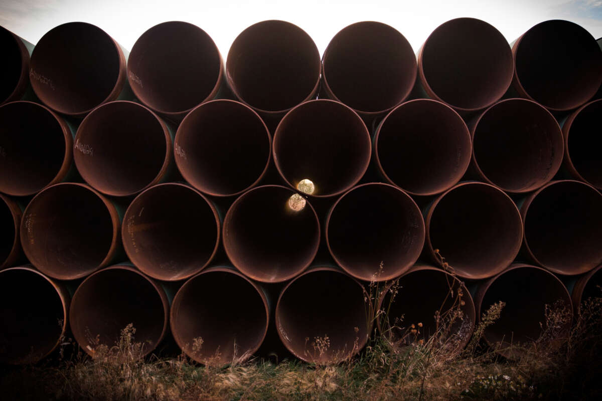 Miles of unused pipe, prepared for the Keystone XL pipeline, sit in a lot on October 14, 2014, outside Gascoyne, North Dakota.