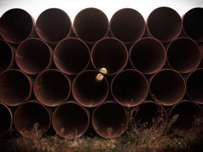 Miles of unused pipe, prepared for the Keystone XL pipeline, sit in a lot on October 14, 2014, outside Gascoyne, North Dakota.