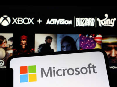 In this photo illustration, the logos of Microsoft and Activision Blizzard are displayed on January 18, 2022.
