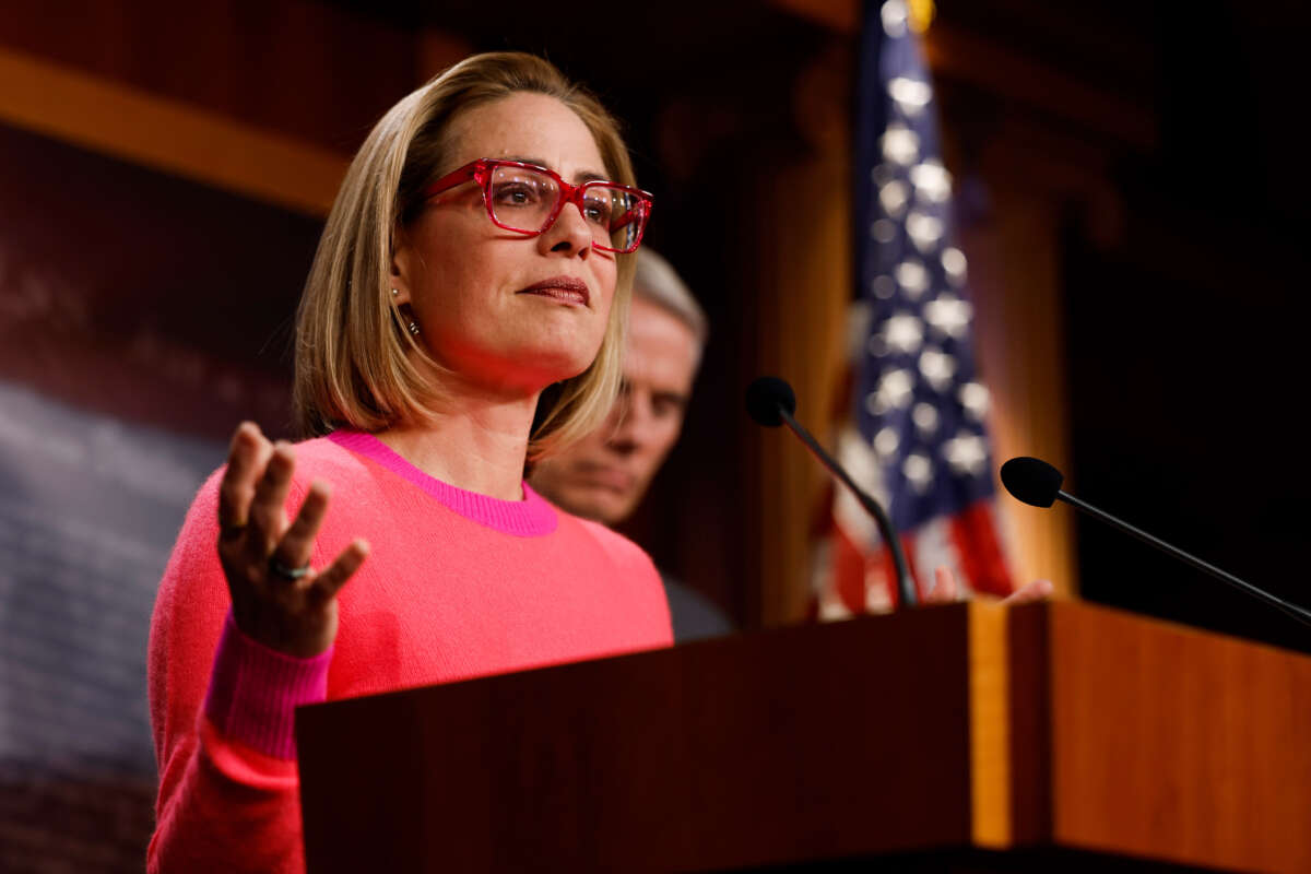 Sen. Kyrsten Sinema speaks at a news conference after the Senate passed the Respect for Marriage Act at the Capitol Building on November 29, 2022, in Washington, D.C.
