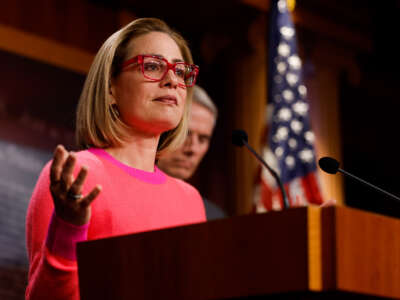 Sen. Kyrsten Sinema speaks at a news conference after the Senate passed the Respect for Marriage Act at the Capitol Building on November 29, 2022, in Washington, D.C.