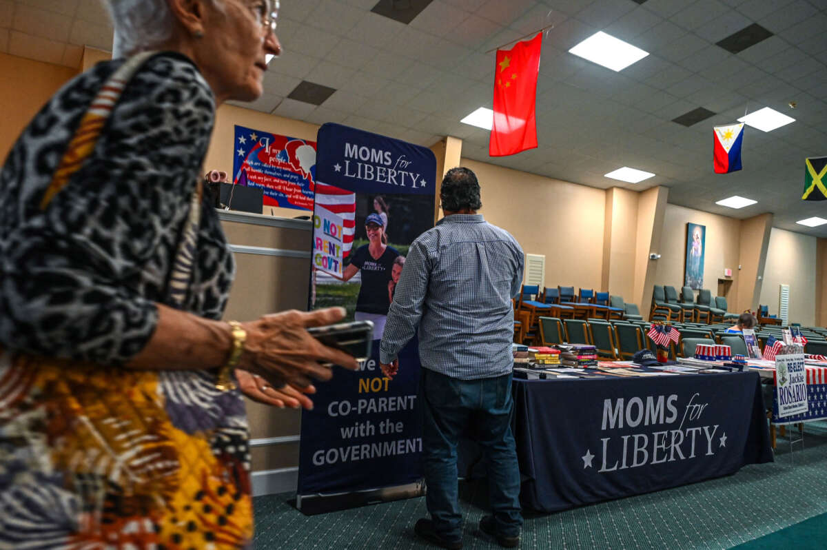 People and members of the Moms For Liberty group attend a campaign event for Jacqueline Rosario in Vero Beach, Florida, on October 16, 2022.