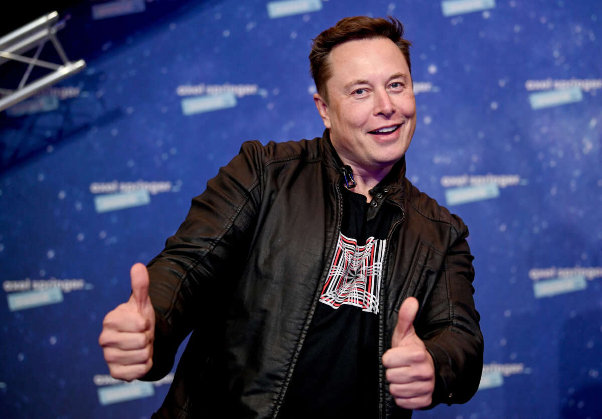 Elon Musk poses as he arrives on the red carpet for the Axel Springer Awards ceremony in Berlin, Germany, on December 1, 2020.