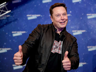 Elon Musk poses as he arrives on the red carpet for the Axel Springer Awards ceremony in Berlin, Germany, on December 1, 2020.