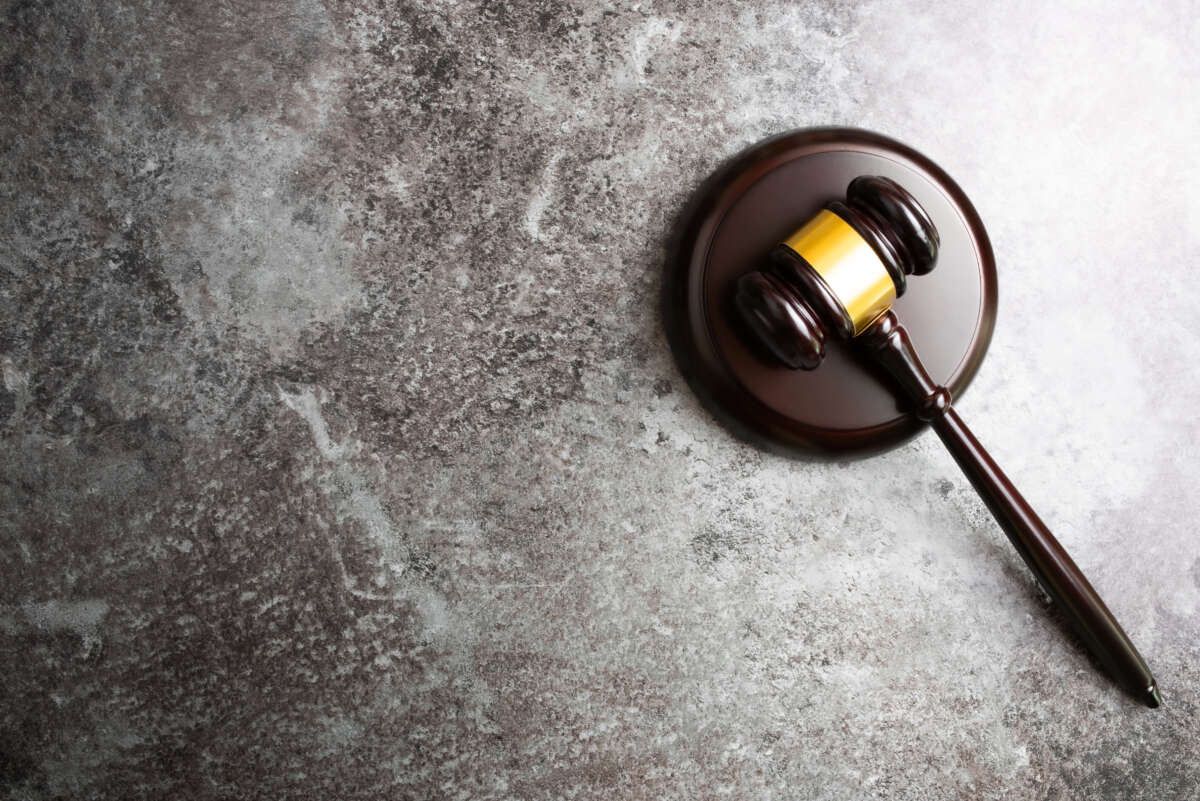 Gavel lying on stone surface