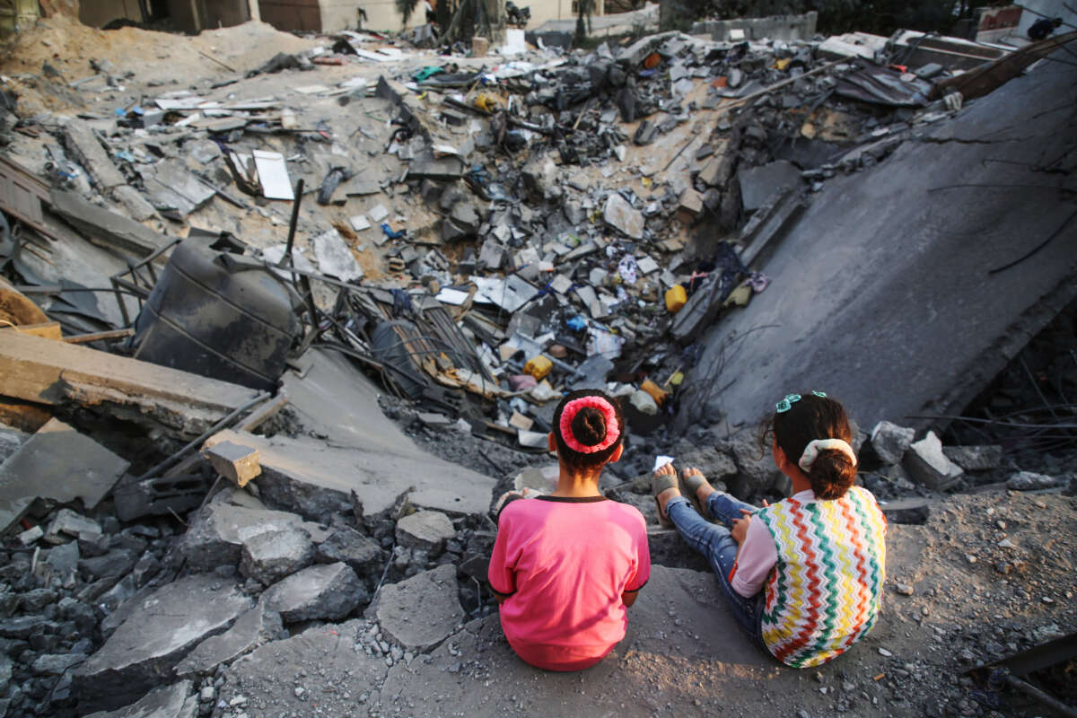 Palestinian children inspect their damaged building in Gaza City on August 9, 2022.