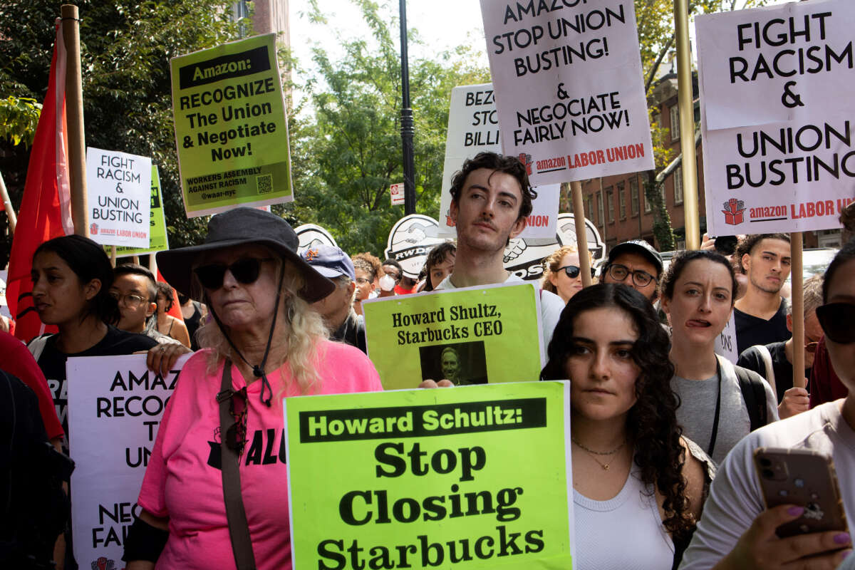 Amazon and Stabucks workers, supported by new service economy unions, march to protest union busting on September 5, 2022, in New York City.