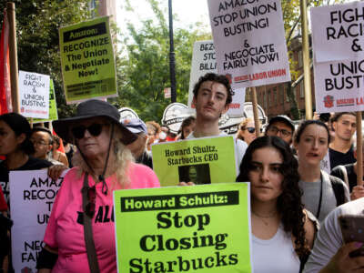 Amazon and Stabucks workers, supported by new service economy unions, march to protest union busting on September 5, 2022, in New York City.