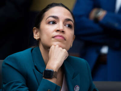 Rep. Alexandria Ocasio-Cortez listens during testimony at the U.S. Capitol on December 13, 2022.