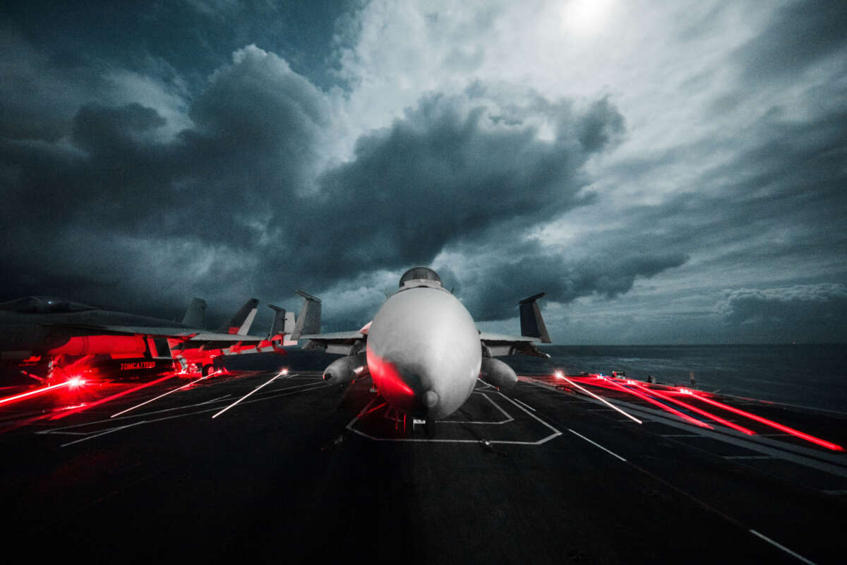 An F/A-18E Super Hornet is chocked and chained to the flight deck of the aircraft carrier USS Gerald R. Ford during operations in the Atlantic Ocean on November 7, 2022.