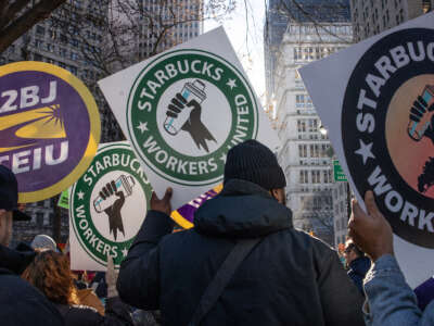 Members of a recently formed union of Starbucks workers hold a rally to celebrate the first anniversary of their founding, December 9, 2022, in New York City, New York.