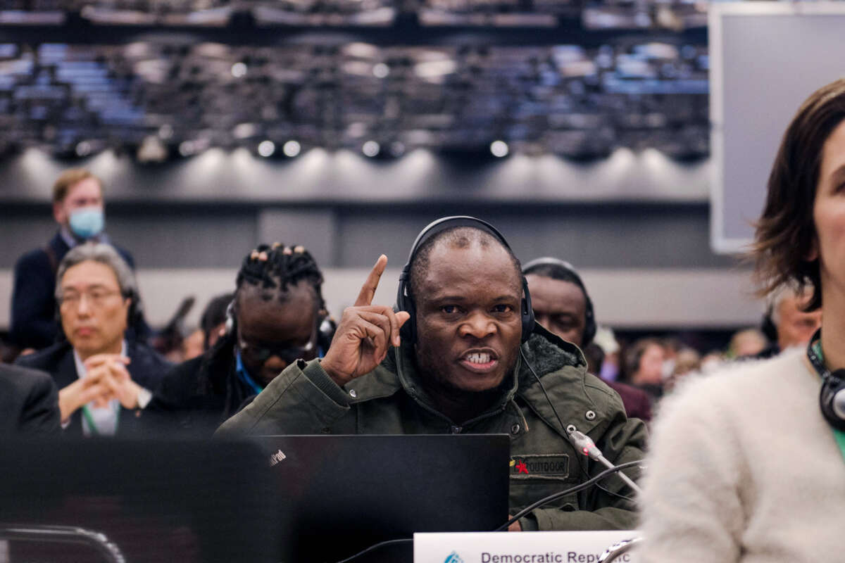 A delegate from the Democratic Republic of Congo speaks into a microphone