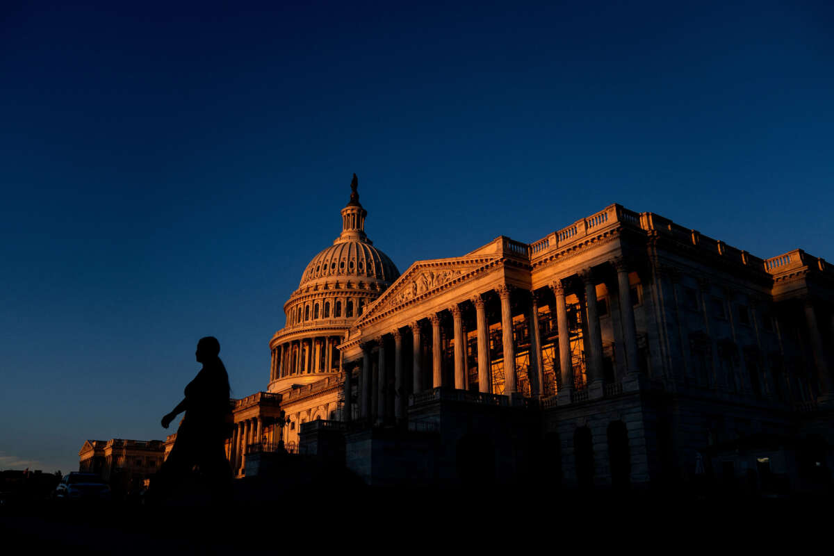 A pedestrian walks past the U.S. Capitol in Washington, D.C., on September 14, 2022.