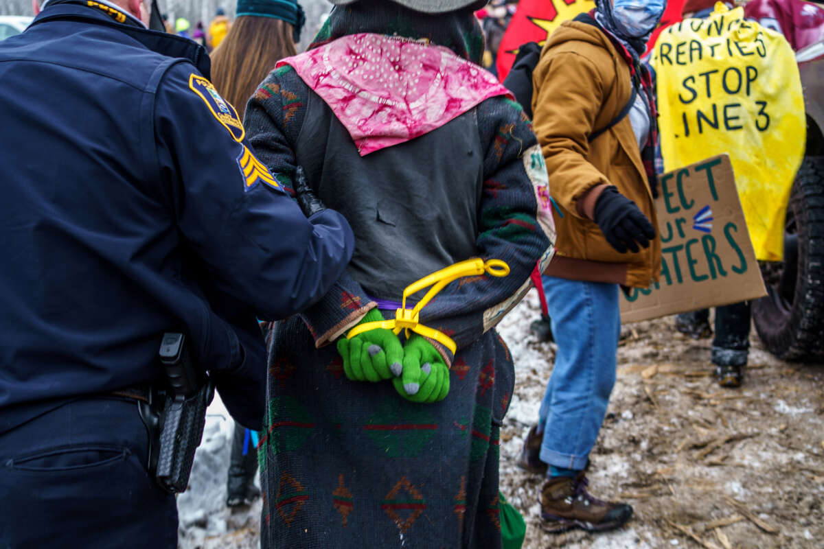 Aitkin County sheriffs arrest Water Protectors during a protest at the construction site of the Line 3 oil pipeline near Palisade, Minnesota, on January 9, 2021.