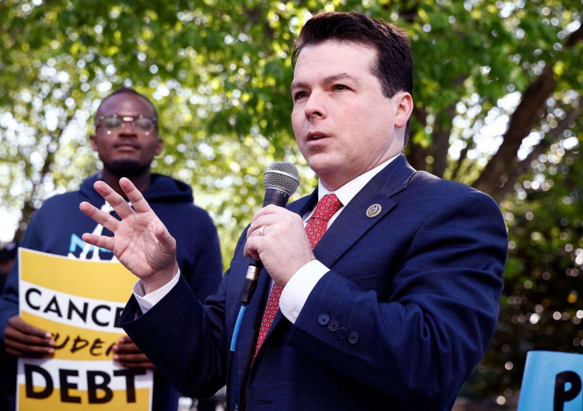 Rep. Brendan Boyle speaks to supporters at an outdoor event