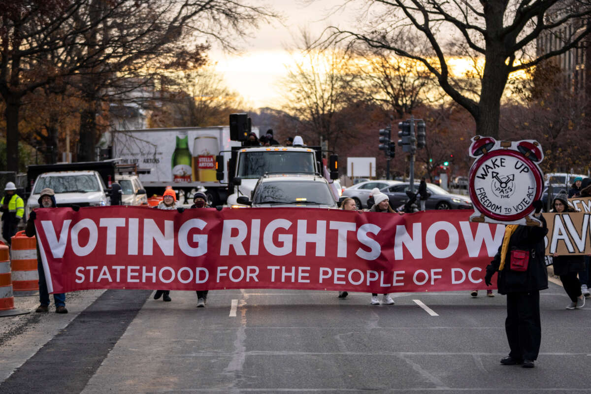 Activists rally for voting rights and DC statehood as they block traffic on Pennsylvania Avenue SE on December 7, 2021, in Washington, D.C.