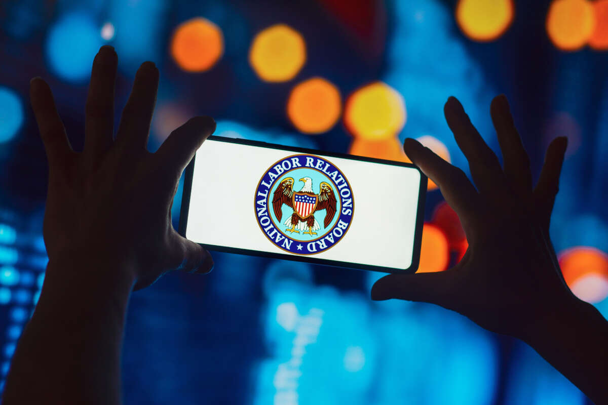 In this photo illustration, the National Labor Relations Board (NLRB) logo is displayed on a smartphone.
