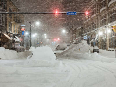 Vehicles are seen abandoned in heavy snowfall in downtown Buffalo, New York, on December 26, 2022.