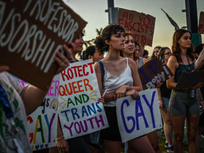 LGBTQ rights supporters protest against Florida Gov. Ron Desantis outside a campaign event at the Alico Arena on November 6, 2022, in Fort Myers, Florida.