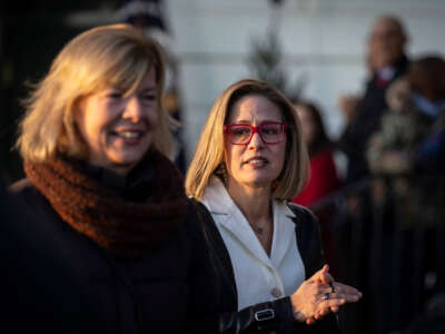 Sen. Kyrsten Sinema departs a signing ceremony for the Respect for Marriage Act on the South Lawn of the White House on December 13, 2022, in Washington, D.C.