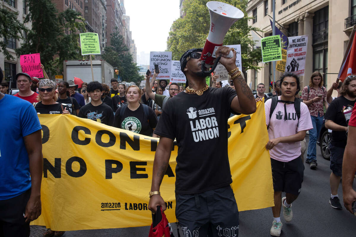 Chris Smalls, a leader of the Amazon Labor Union, leads a march of Starbucks and Amazon workers and their allies to the homes of their CEOs to protest union busting on Labor Day, September 5, 2022, in New York City, New York.