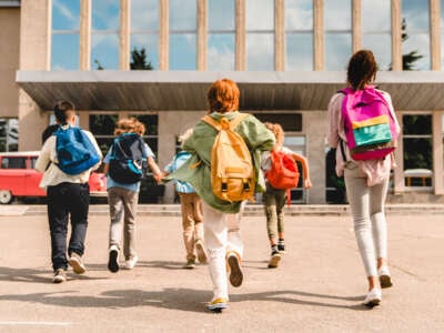 Students run toward school