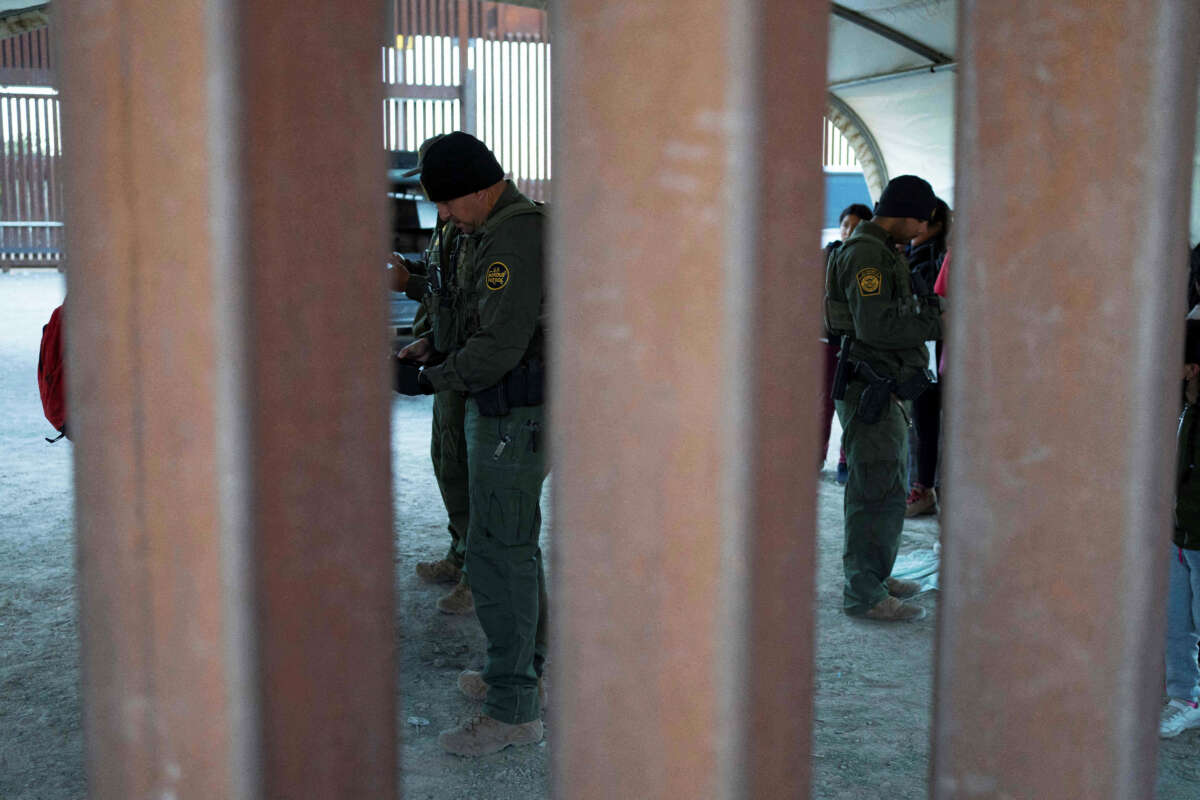 U.S. Border Patrol agents process asylum-seekers in San Luis, Arizona, on December 25, 2022.