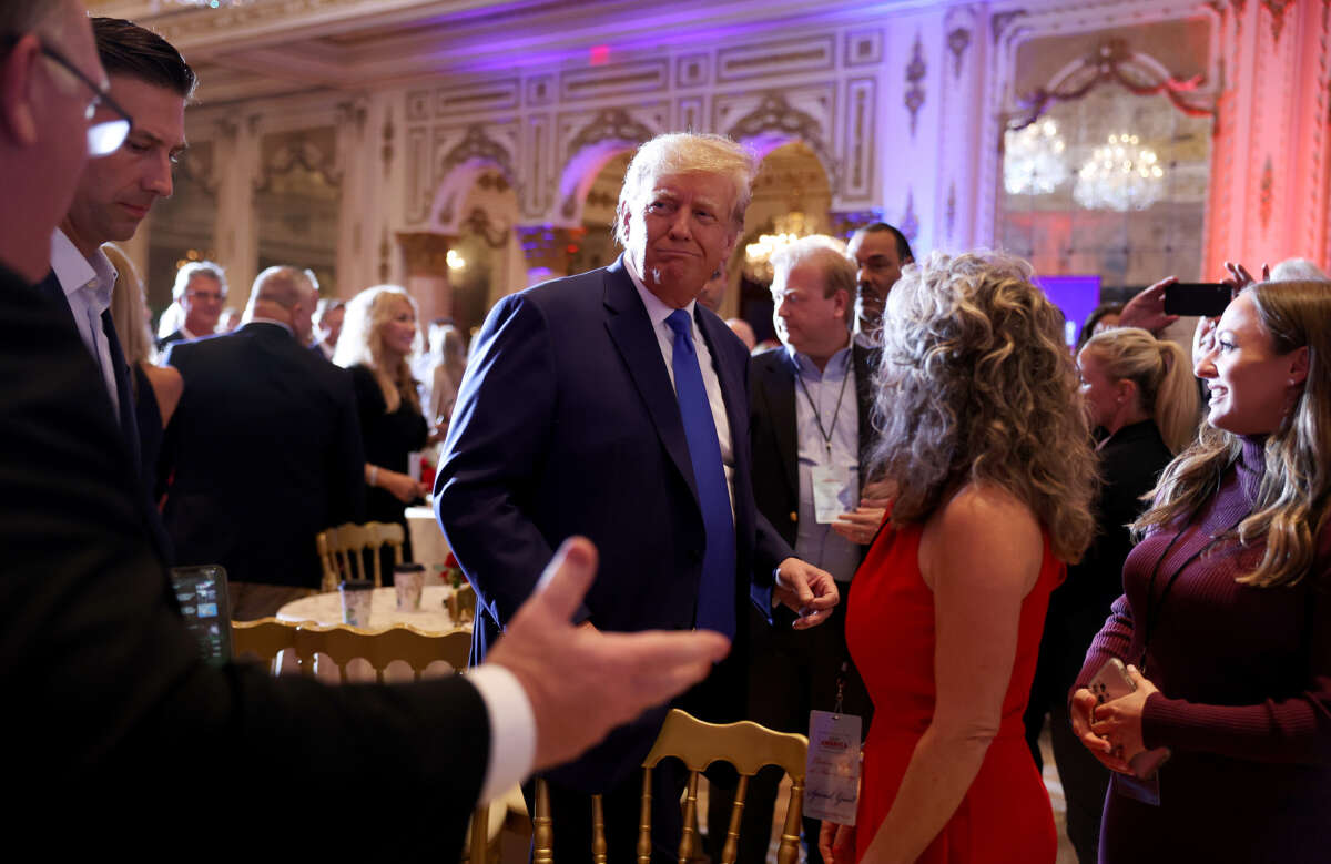 Former President Donald Trump mingles with supporters during an election night event at Mar-a-Lago on November 8, 2022, in Palm Beach, Florida.