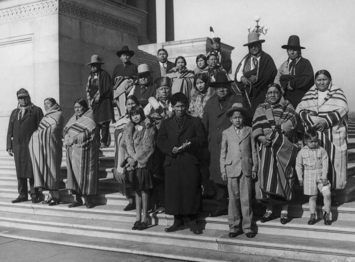 Members of the Osage Nation from Oklahoma on the steps of the Capitol in Washington D.C., during a visit to lobby senators over conditions among Native Americans in Oklahoma, and also regarding their oil leases, circa 1925.