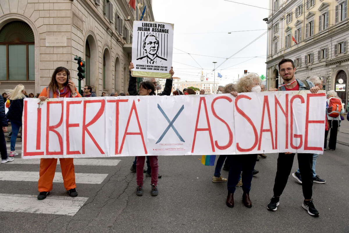 People with a banner calling for freedom for Julian Assange participate in the national demonstration against the war in Ukraine and all wars on November 5, 2022 in Rome, Italy.