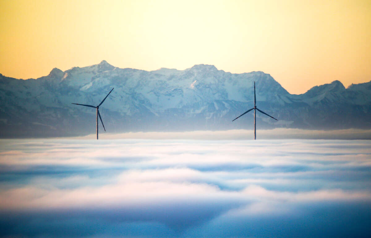 Two wind turbines rise out of the fog cover in Uttenweiler, Germany on the morning of November 27, 2022.