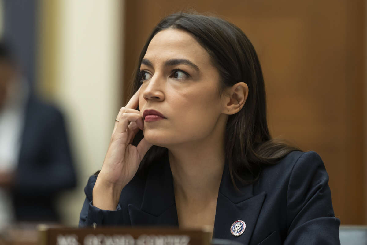 Rep. Alexandria Ocasio-Cortez listens to testimony during a House Financial Services Committee hearing at the U.S. Capitol on December 13, 2022 in Washington, D.C.