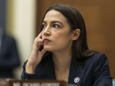 Rep. Alexandria Ocasio-Cortez listens to testimony during a House Financial Services Committee hearing at the U.S. Capitol on December 13, 2022 in Washington, D.C.