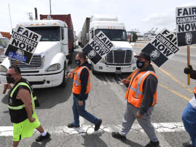 Longshore workers walk off the job in solidarity with the teamsters to picket and disrupt traffic in San Pedro, California on Wednesday, April 14, 2021.