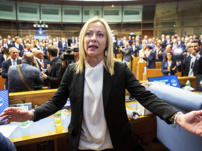Giorgia Meloni, leader of the Brothers of Italy party and winner of the Italian election, poses for photographers during a meeting with newly elected deputies and senators of her party, on October 10, 2022 in Rome, Italy.