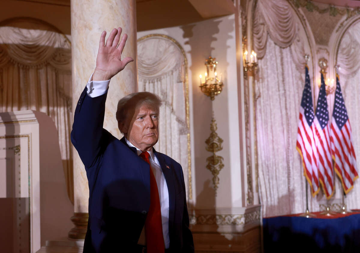 Former U.S. President Donald Trump waves after officially launching his 2024 presidential campaign at his Mar-a-Lago home on November 15, 2022 in Palm Beach, Florida.
