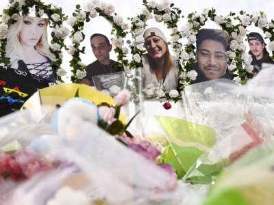 Photographs of victims of the Club Q mass shooting are on display at a memorial on November 23, 2022 in Colorado Springs, Colorado.