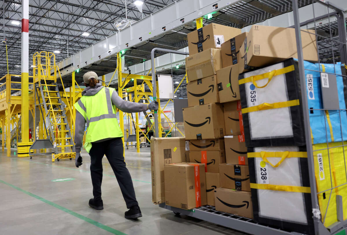 Amazon worker moving packages in a warehouse